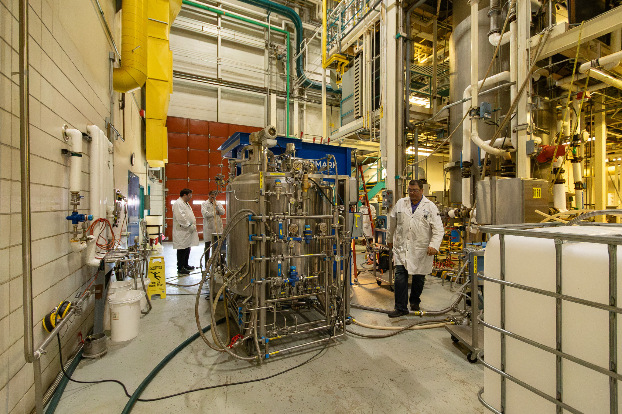 Large-scale industrial processing equipment inside a Safion operating environment